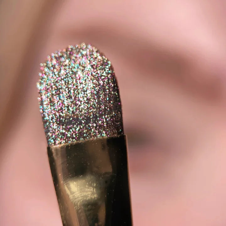 Close-up of reflective shimmer pigment on an applicator