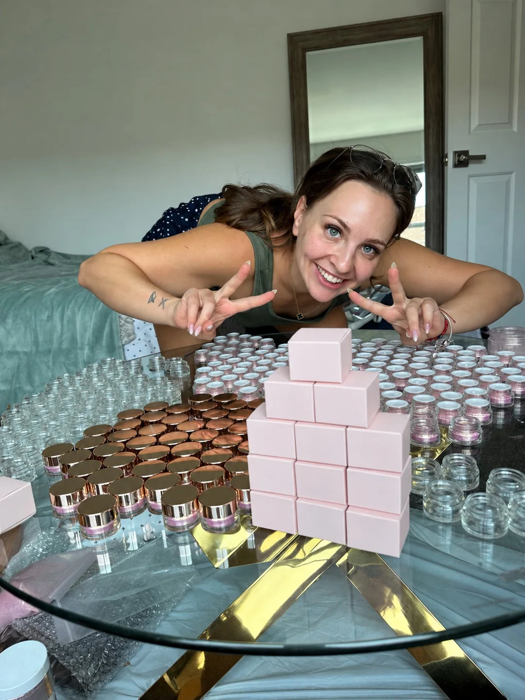 Behind the scenes with loose shimmer pigment jars and packaging